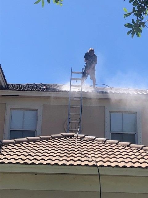 Clean tile roof after low-pressure soft wash treatment, Vero Beach FL